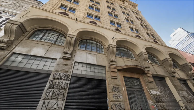 A photo of a building in downtown Sao Paolo illustrates a guest post on impact investing in housing